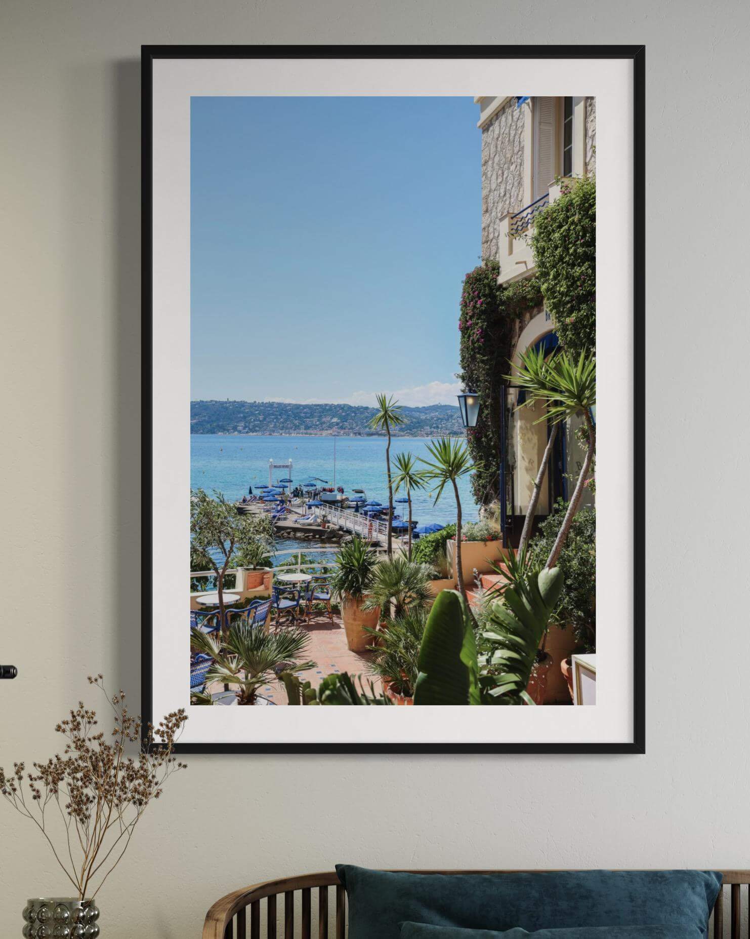 Stunning view of the Cote d'Azur from Bar Fitzgerald featuring vibrant greenery and waterfront boats.