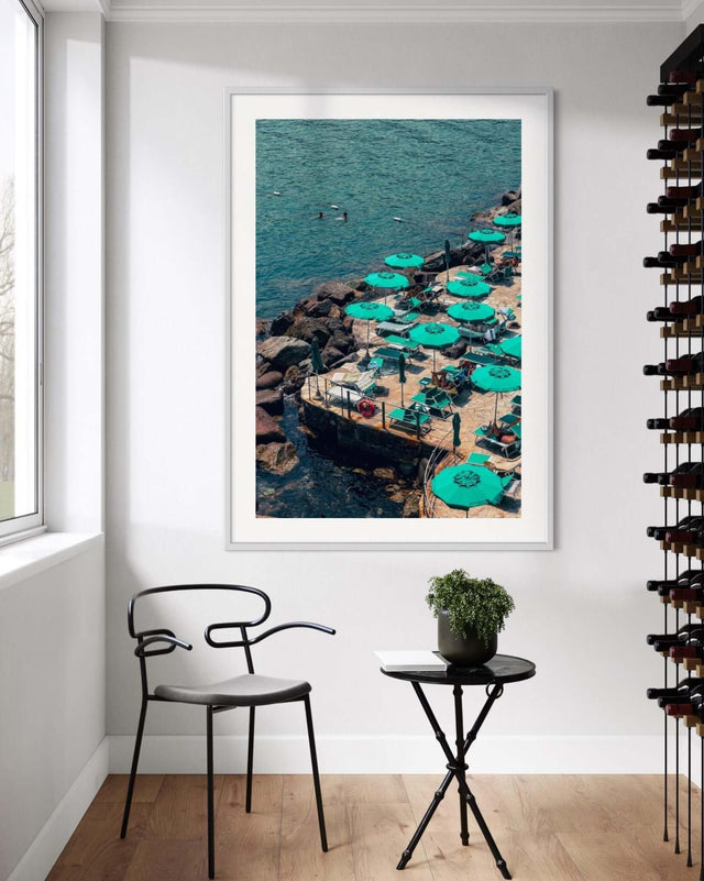 Framed, Wall Art Print of Santa Margherita Ligure featuring green umbrellas by the shoreline.
