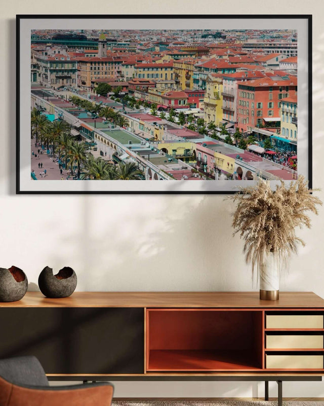 Cote d'Azur Print showcasing Cours Saleya market square in Nice with colorful buildings and palm trees.