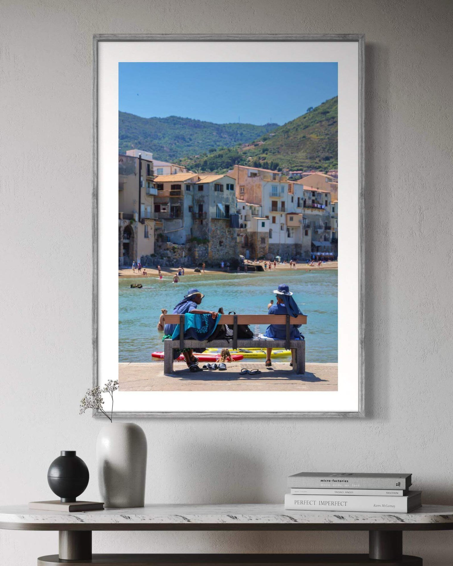 Céfalu Print featuring two women on a bench by the water in Sicily, enjoying the sun and each other's company.