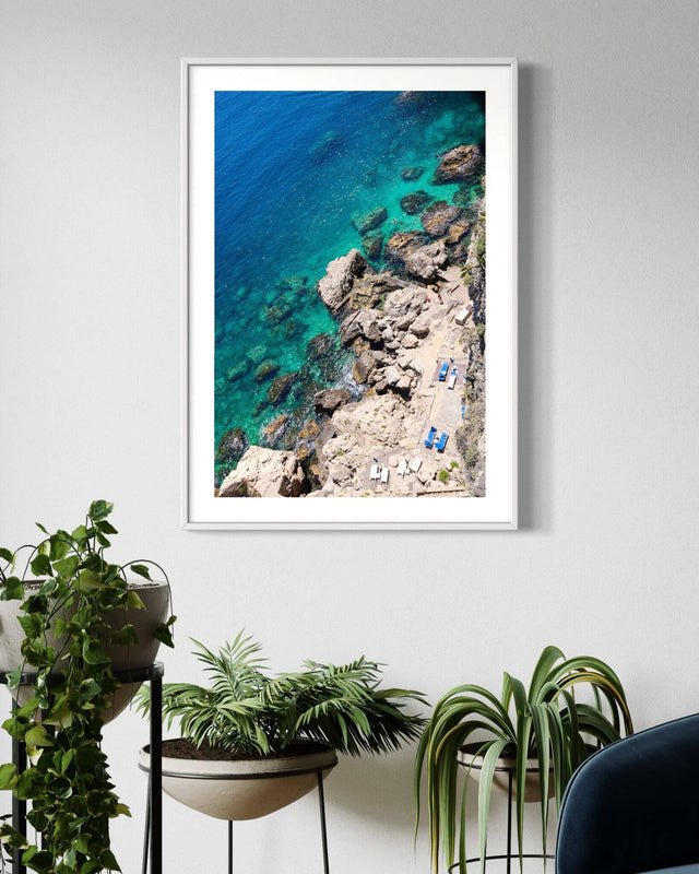 Italy Beach Print showcasing a stunning aerial view of a rocky coastline and turquoise Mediterranean water.