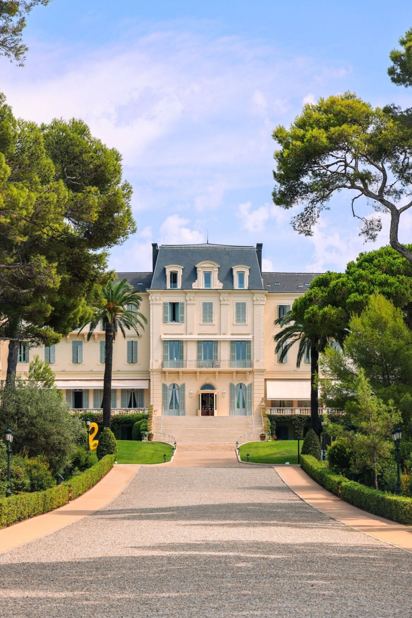 Eden Roc Print of the luxurious Hotel du Cap Eden Roc in Antibes surrounded by lush greenery and palm trees.