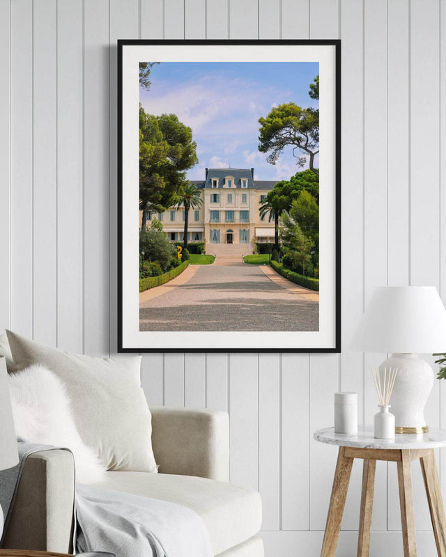 Eden Roc Print of the luxurious Hotel du Cap Eden Roc in Antibes, framed on a modern living room wall.