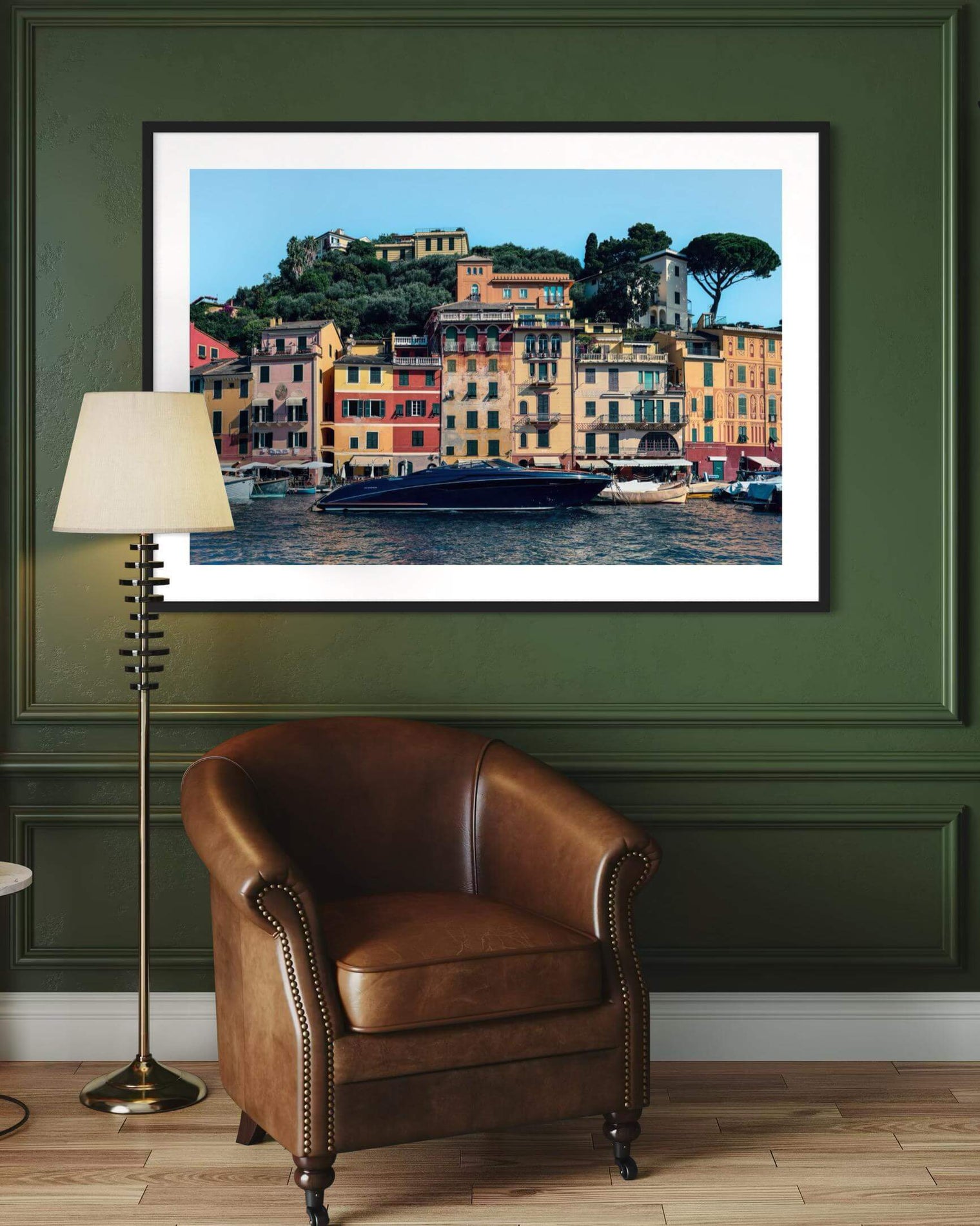 Wall hung Riva Print of a sleek yacht moored in Portofino harbor with colorful buildings in the background.