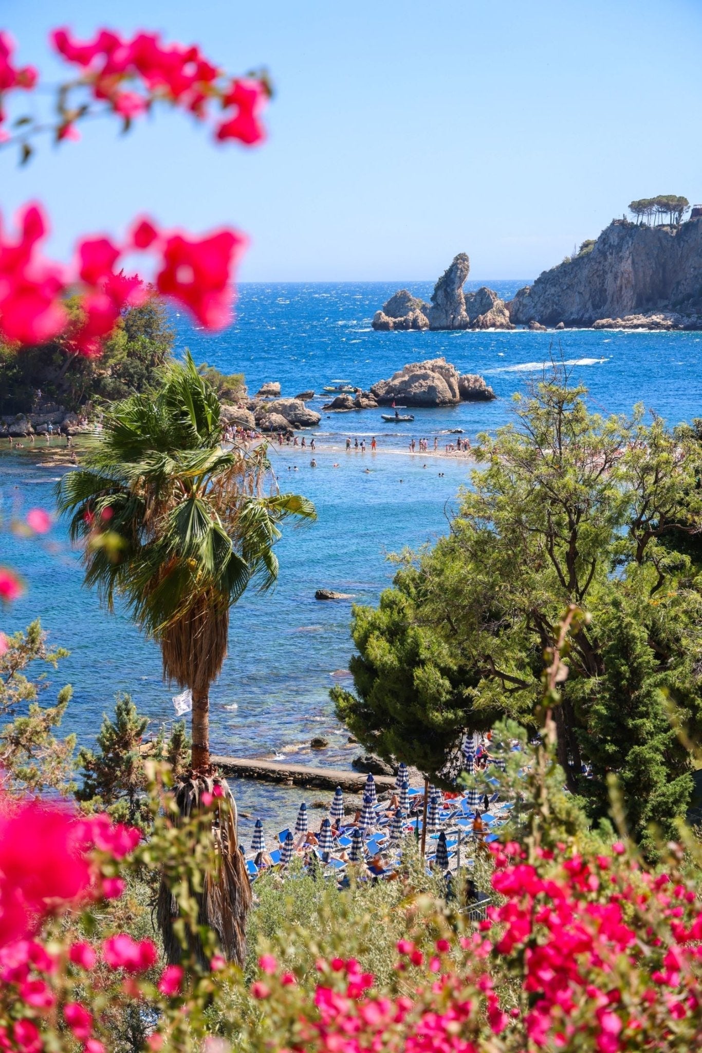 Sicily Print of Isola Bella showing iconic coastal view with flowers and beachgoers.