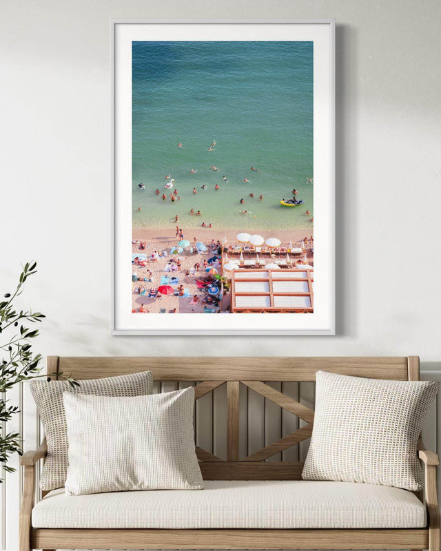 Colorful Villefranche Print capturing sunbathers and turquoise waters at a beach in Côte d’Azur.