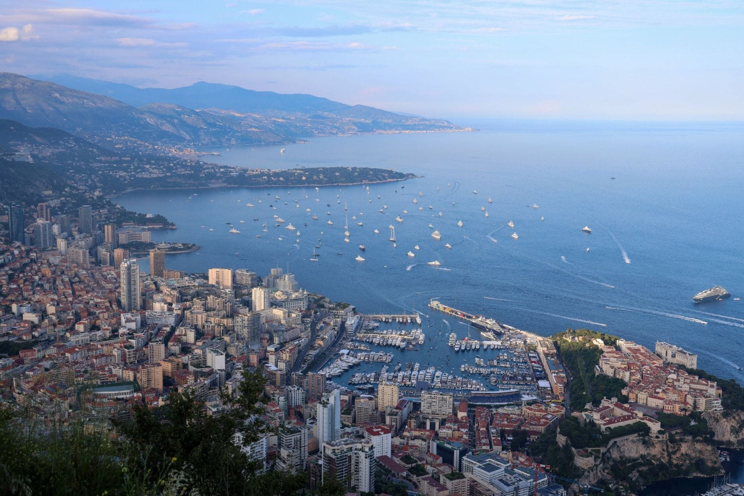 Stunning view of Monaco with luxury yachts on the Mediterranean, featured in Superyacht Print for Monaco F1 Weekend.