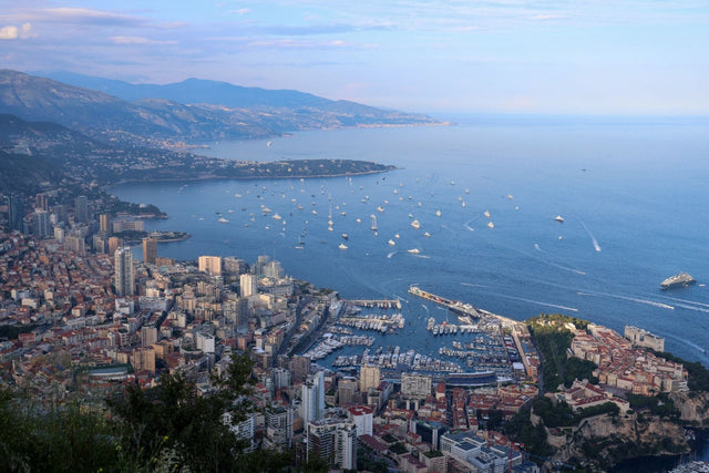 Stunning view of Monaco with luxury yachts on the Mediterranean, featured in Superyacht Print for Monaco F1 Weekend.