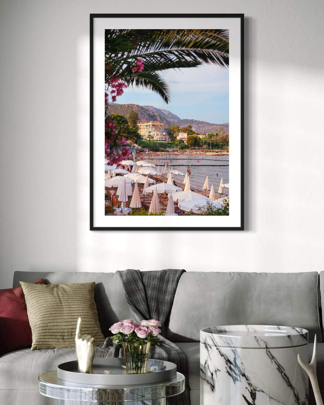 Elegant Beaulieu Print showcasing a sunny Côte d’Azur beach scene with palm trees and charming villas.