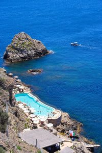 Italy Beach Print featuring the beautiful pool at Unahotels Capotaormina in Taormina, Sicily with a stunning coastal view.